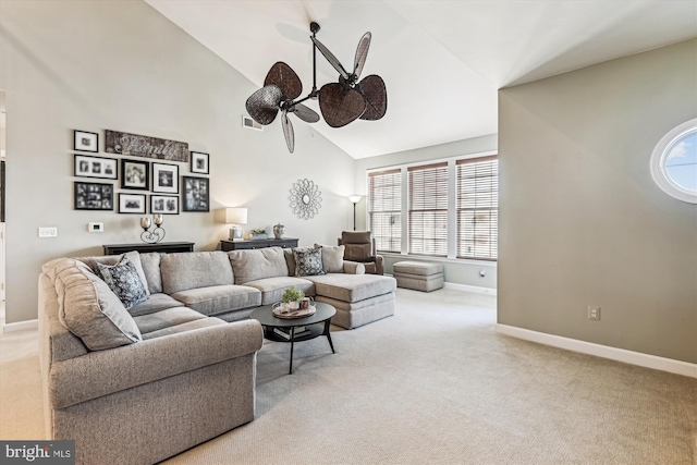 living room with ceiling fan, light carpet, and high vaulted ceiling