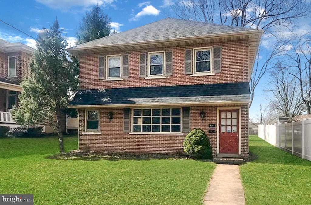 front facade with a front yard