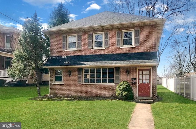 front facade with a front yard