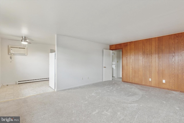 carpeted empty room with ceiling fan, an AC wall unit, baseboard heating, and wood walls