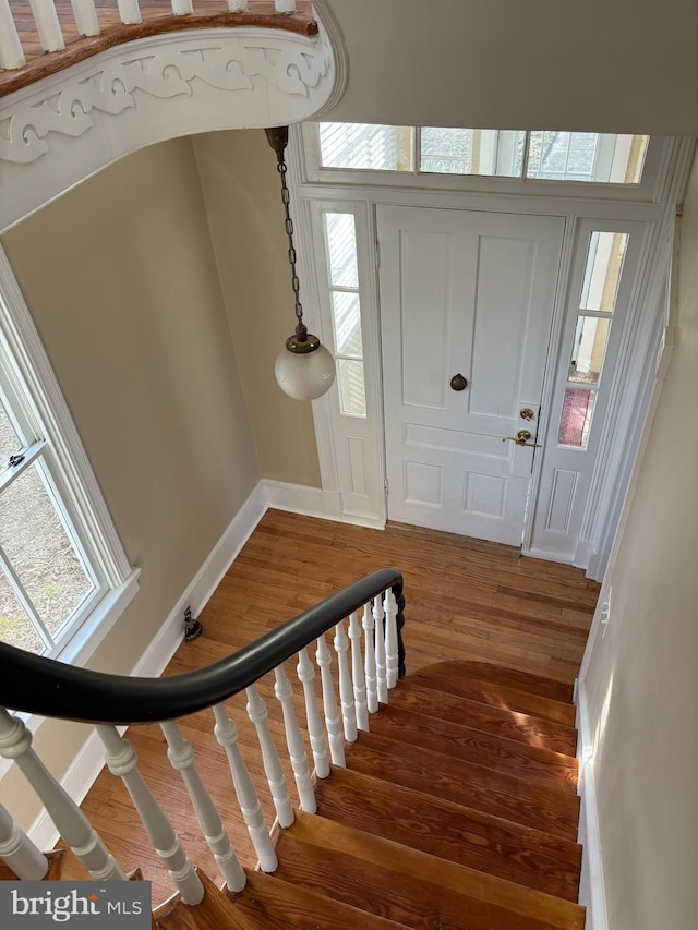 staircase featuring hardwood / wood-style floors