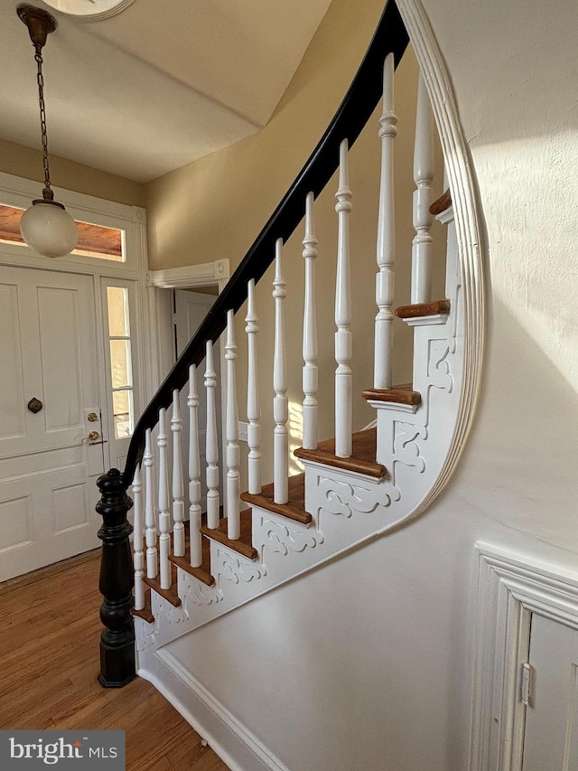 stairs with wood-type flooring