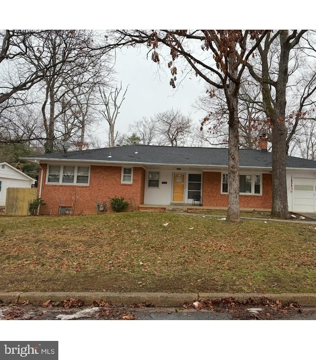 view of front of home featuring a garage and a front yard