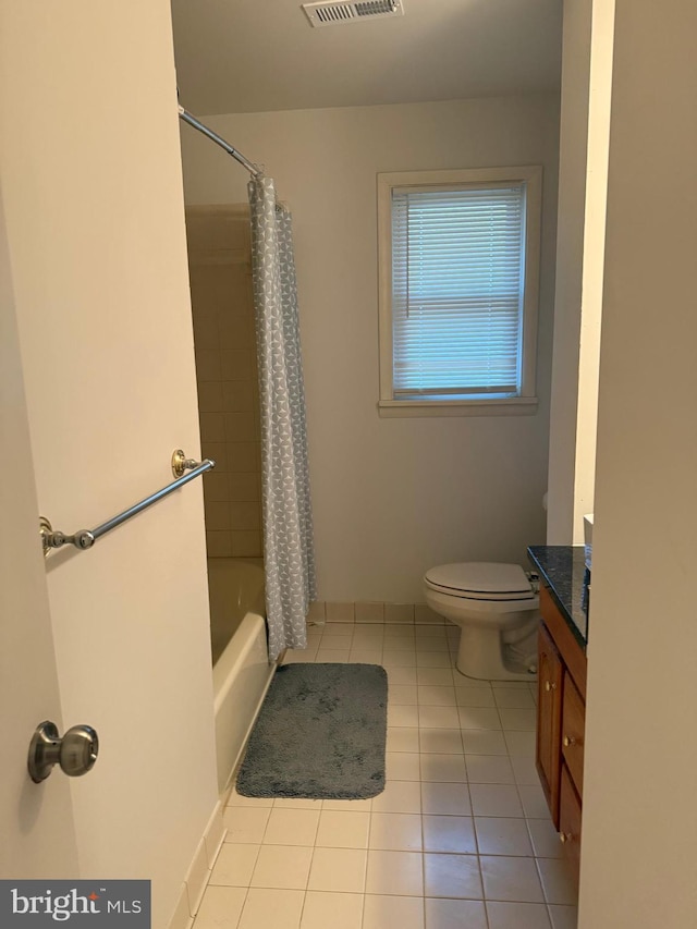 full bathroom with vanity, tile patterned flooring, toilet, and shower / tub combo with curtain