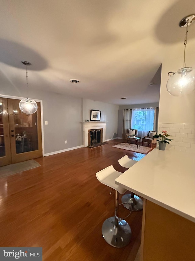 unfurnished living room featuring wood-type flooring