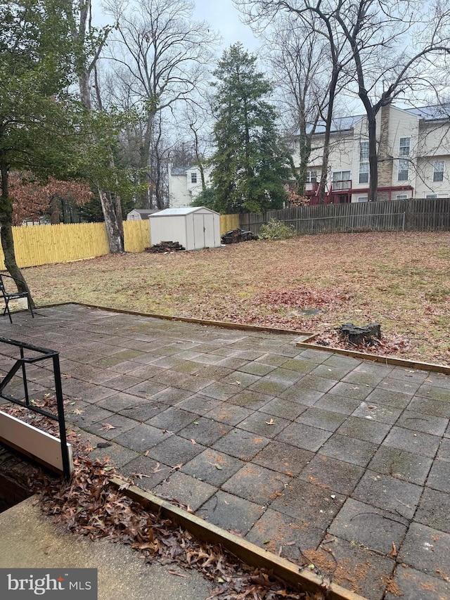 view of patio / terrace with a shed