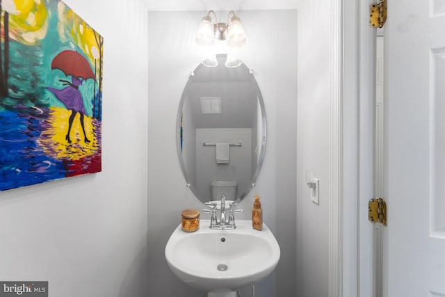 bathroom featuring sink and toilet