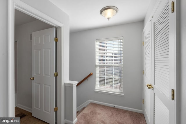 corridor with light carpet