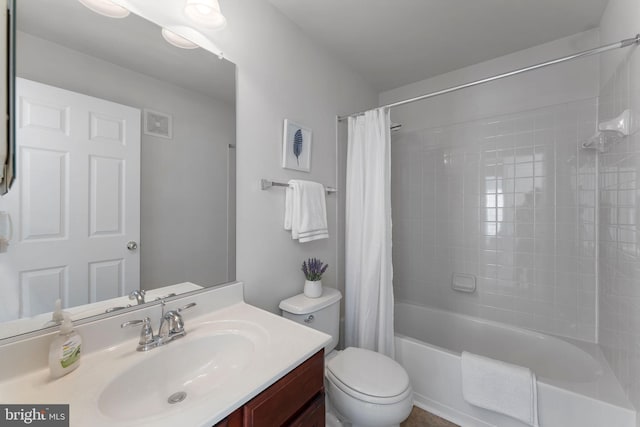 full bathroom with shower / tub combo, vanity, and toilet