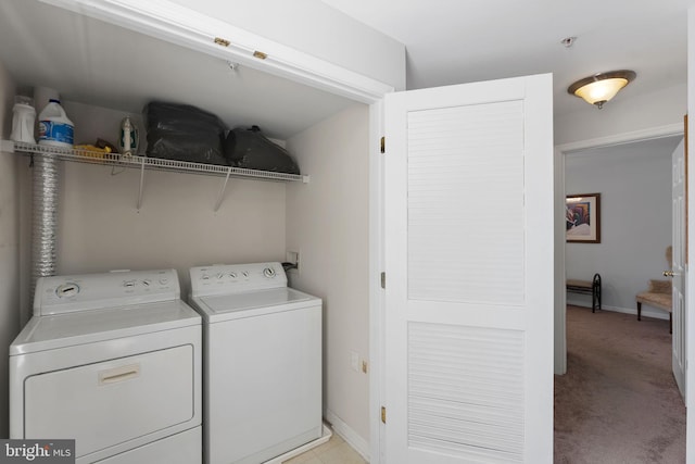 laundry area featuring light carpet and independent washer and dryer