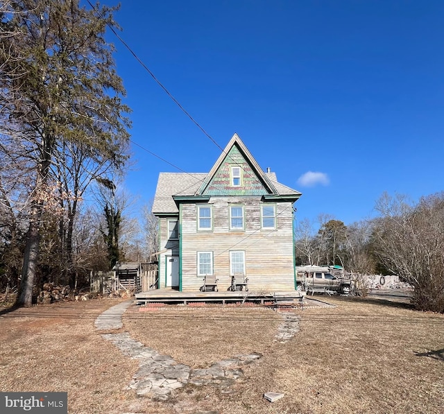 back of house with a wooden deck