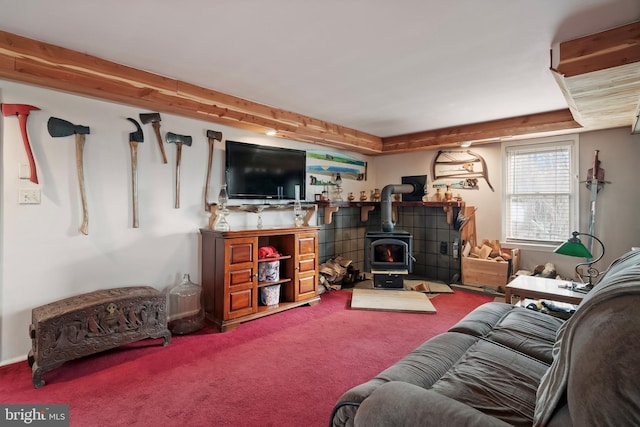 living room featuring a wood stove and carpet flooring