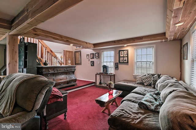 living room featuring beam ceiling and carpet floors