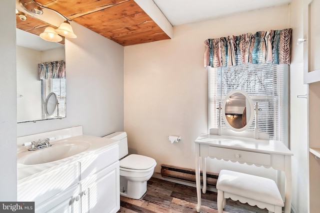 bathroom with vanity, toilet, hardwood / wood-style floors, and wooden ceiling