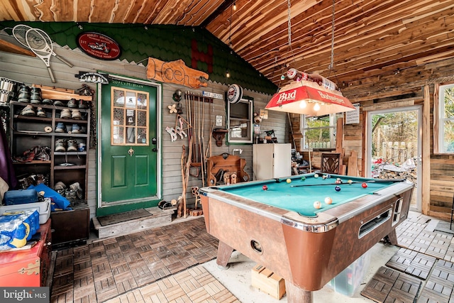 game room featuring billiards, lofted ceiling, wooden ceiling, and wood walls