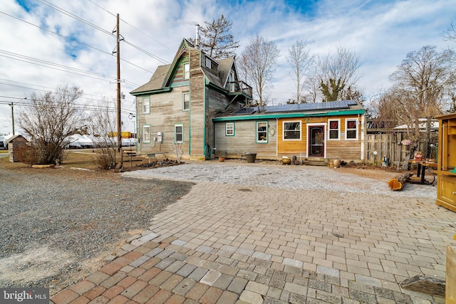 back of property with solar panels