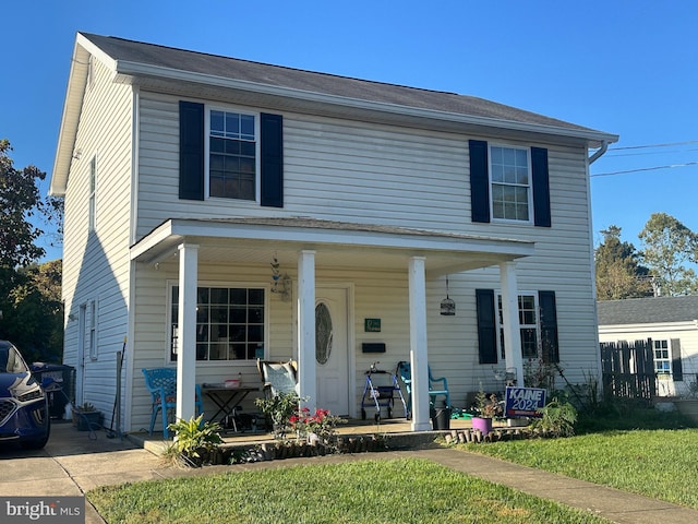 view of front of property with a front lawn and a porch