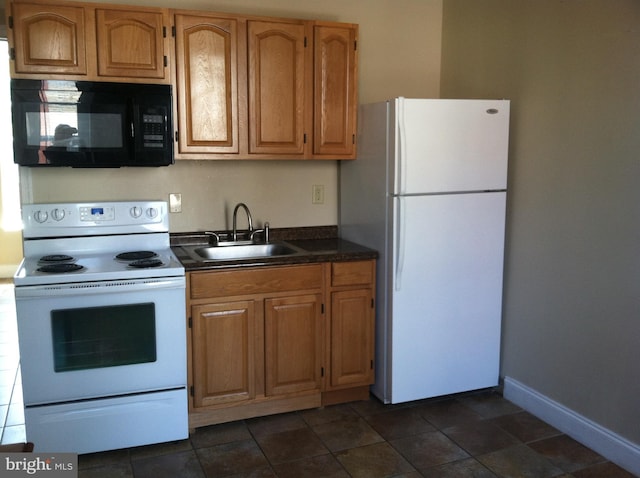 kitchen with sink and white appliances