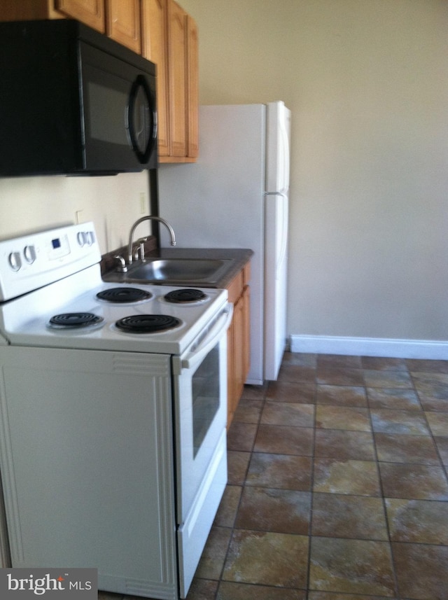 kitchen with sink and electric range