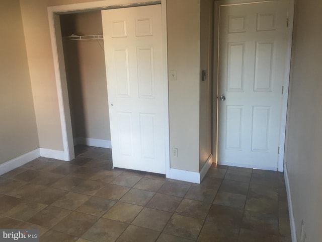 unfurnished bedroom with a closet