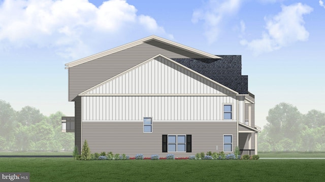 view of side of home featuring a lawn, board and batten siding, and a shingled roof