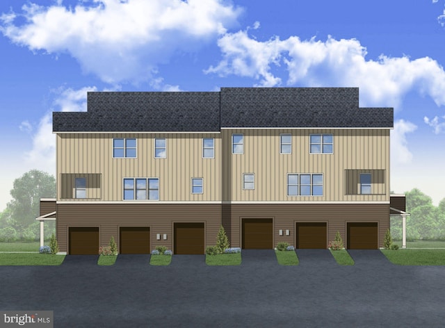 view of front of house featuring an attached garage, a shingled roof, and driveway