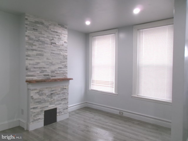 unfurnished living room with light hardwood / wood-style floors