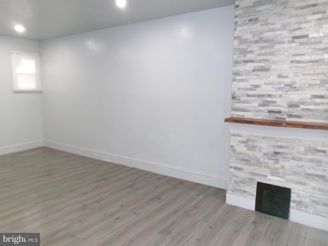 unfurnished room with hardwood / wood-style floors