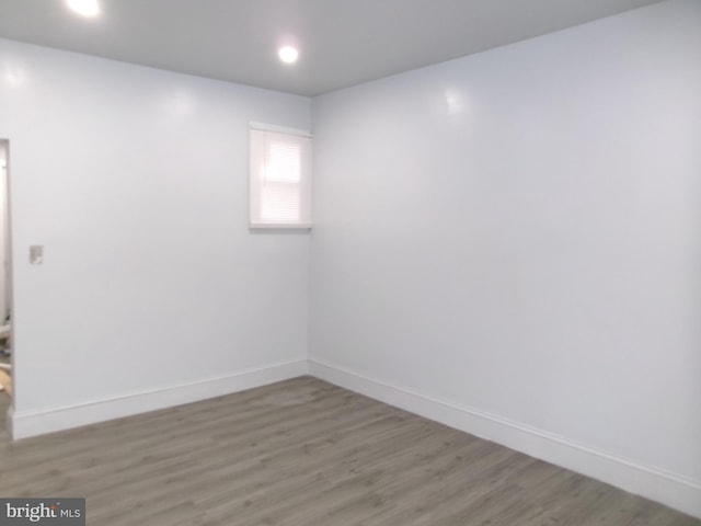 spare room with wood-type flooring