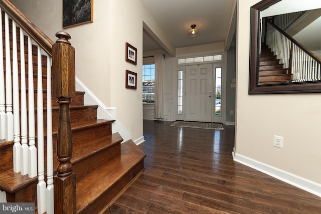 entrance foyer with dark hardwood / wood-style floors