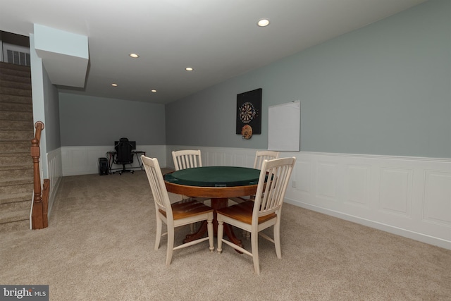 dining room with light colored carpet