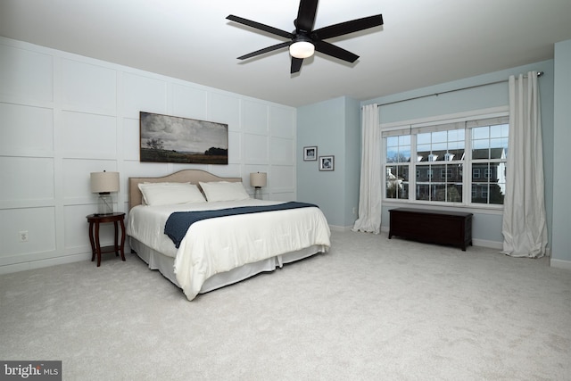 bedroom with ceiling fan and light colored carpet