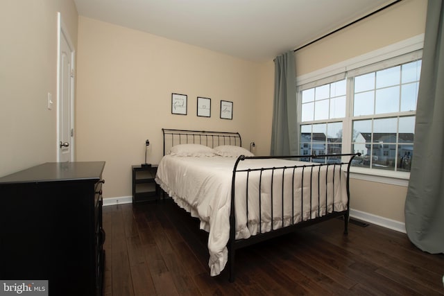 bedroom featuring dark hardwood / wood-style flooring