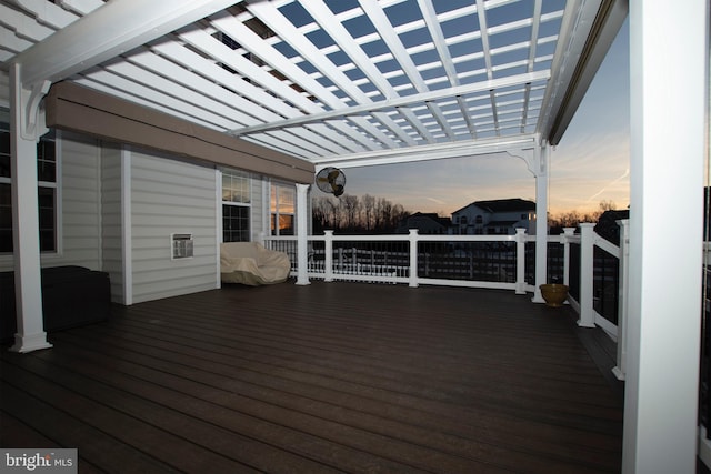 deck at dusk with a pergola