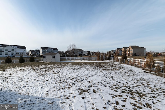 view of yard layered in snow