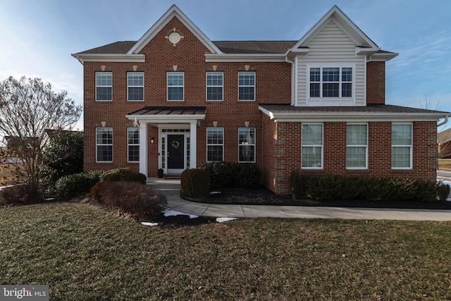 view of front facade with a front yard