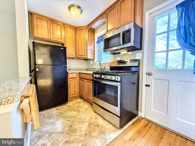 kitchen with appliances with stainless steel finishes and sink