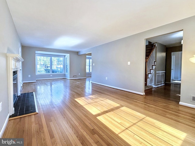 unfurnished living room with hardwood / wood-style floors