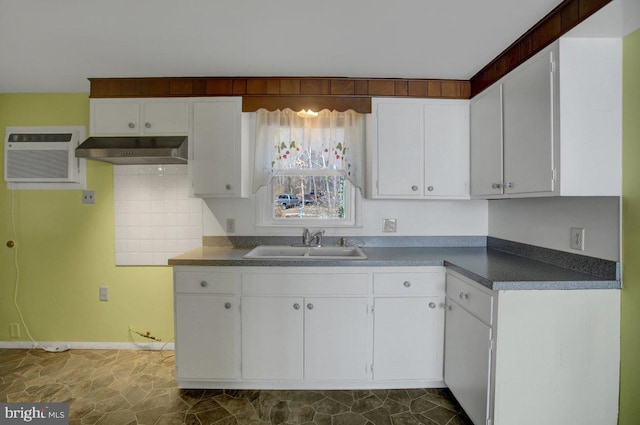 kitchen featuring white cabinetry, a wall mounted AC, and sink