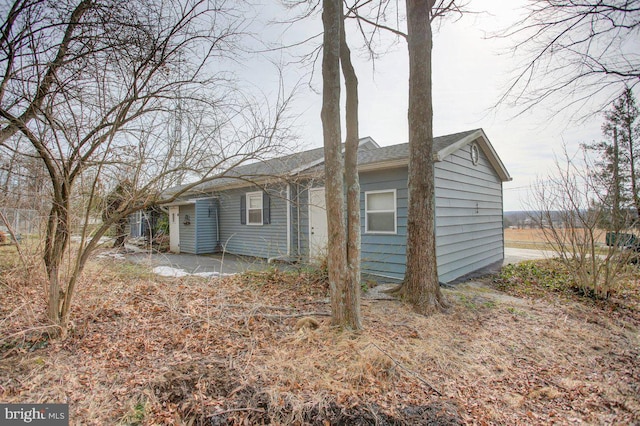 view of side of home with a patio