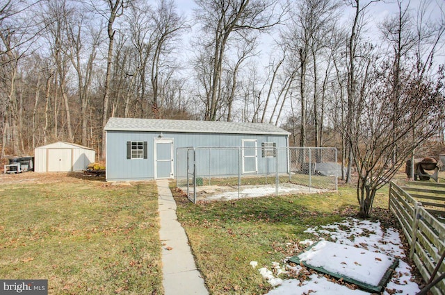 view of outbuilding with a yard