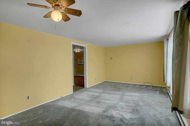 carpeted empty room featuring ceiling fan and baseboard heating