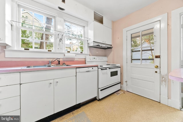 kitchen with sink, white cabinets, and white appliances