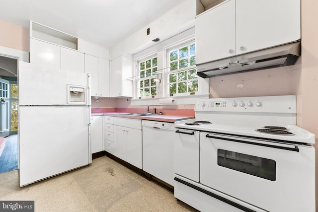 kitchen with sink, white cabinets, and white appliances