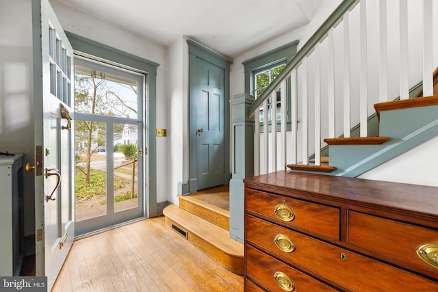 entryway featuring a healthy amount of sunlight and light hardwood / wood-style floors