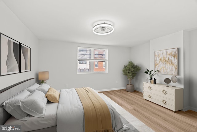 bedroom with light hardwood / wood-style flooring