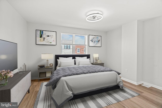 bedroom with light hardwood / wood-style flooring