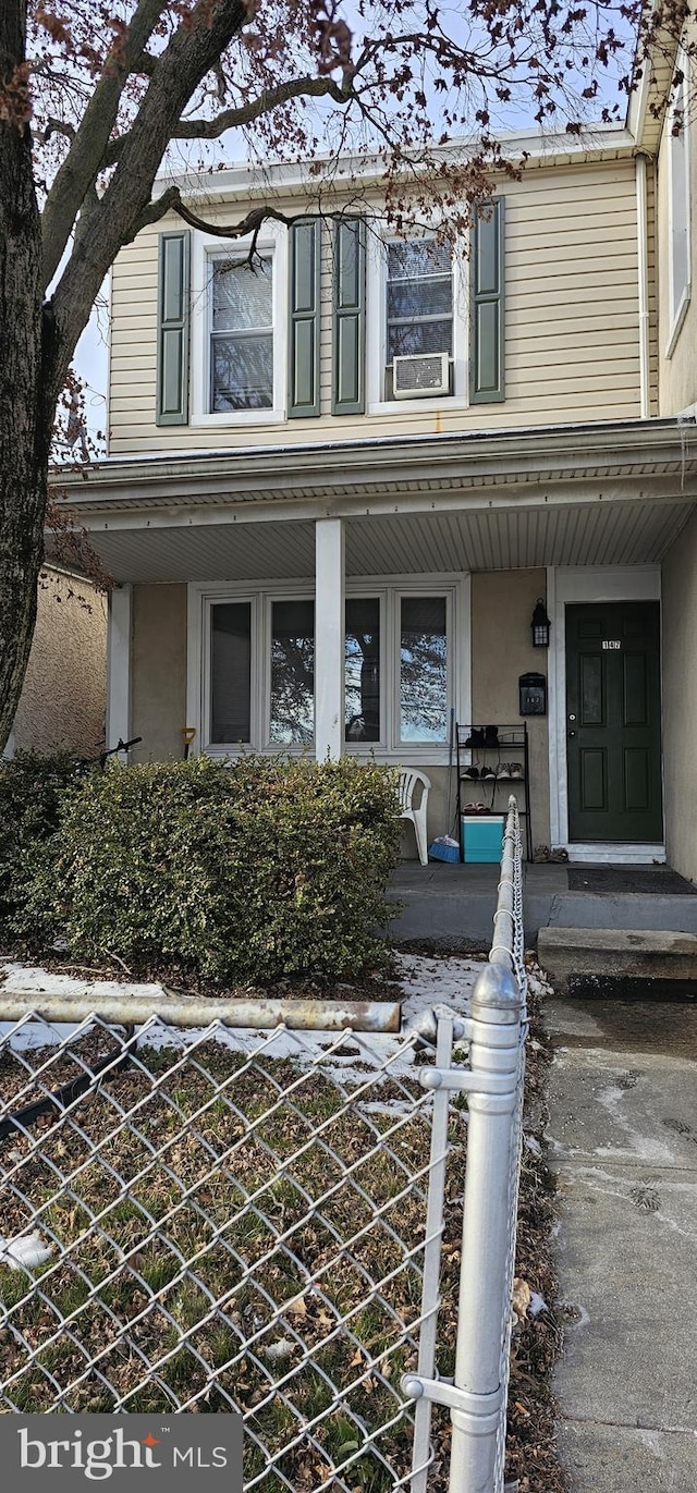 doorway to property with a porch