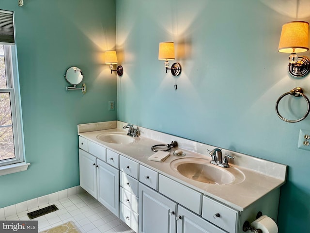 bathroom with vanity, tile patterned flooring, and plenty of natural light