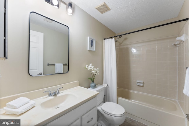 bathroom featuring vanity, visible vents, shower / bath combination with curtain, a textured ceiling, and toilet